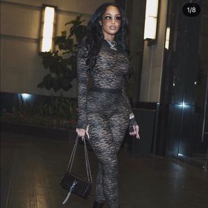 Black lace 2 piece set / top is a body suit / does have a liner nt see through